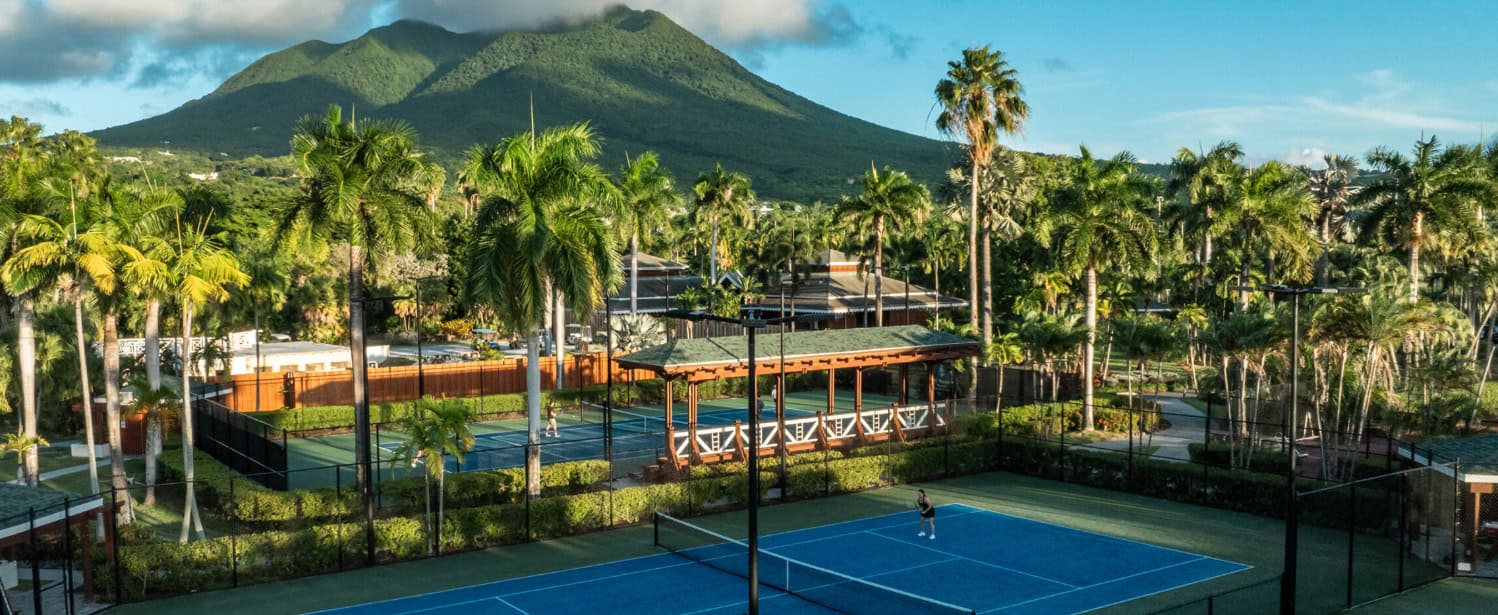 Tennis court in front of a volcano