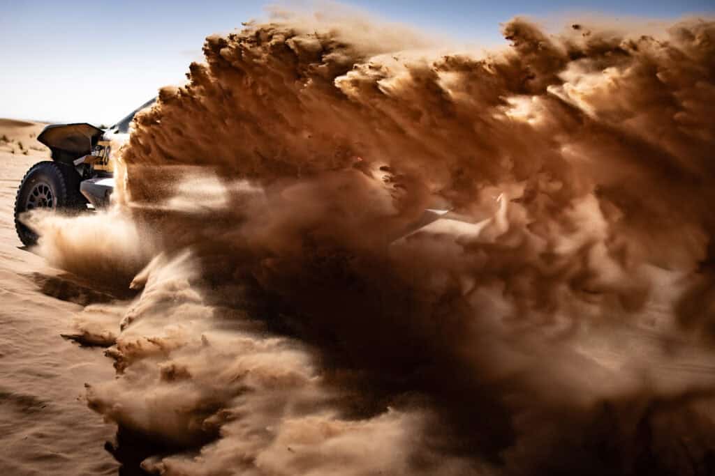 Car in a whirlwind of sand