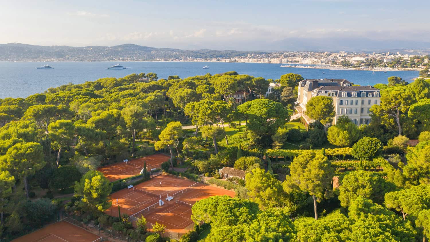 Tennis court overlooking the ocean shoreline
