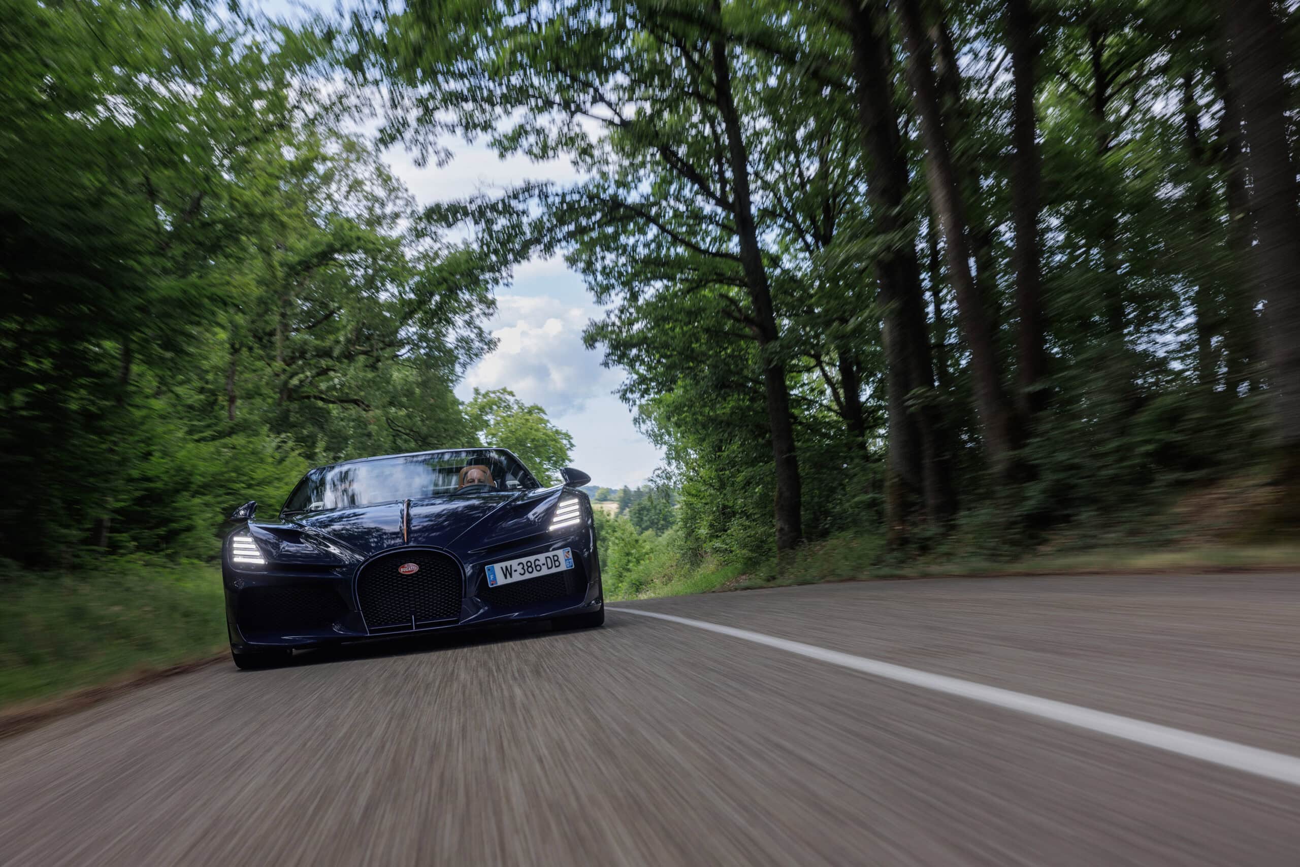 Bugatti zooming on a country road